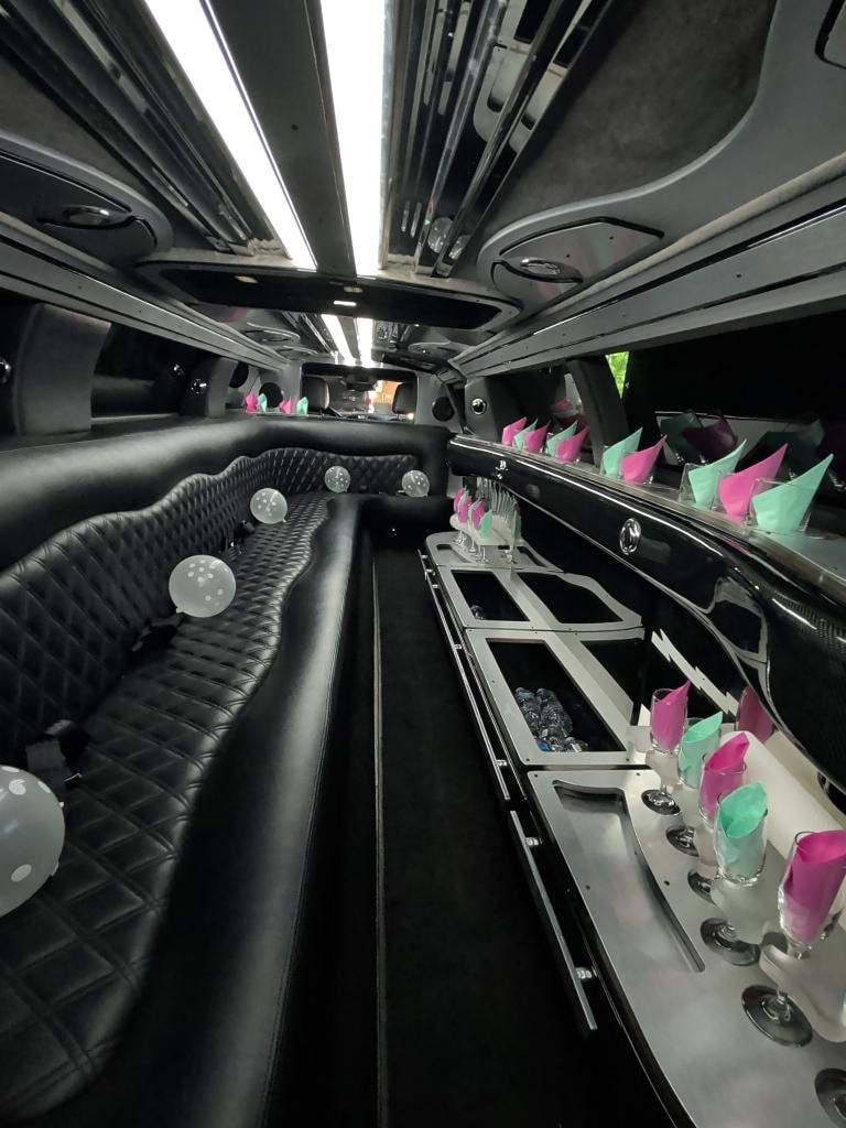 Chrysler 300 interior — diamond-stitch seating with champagne flutes and party setup