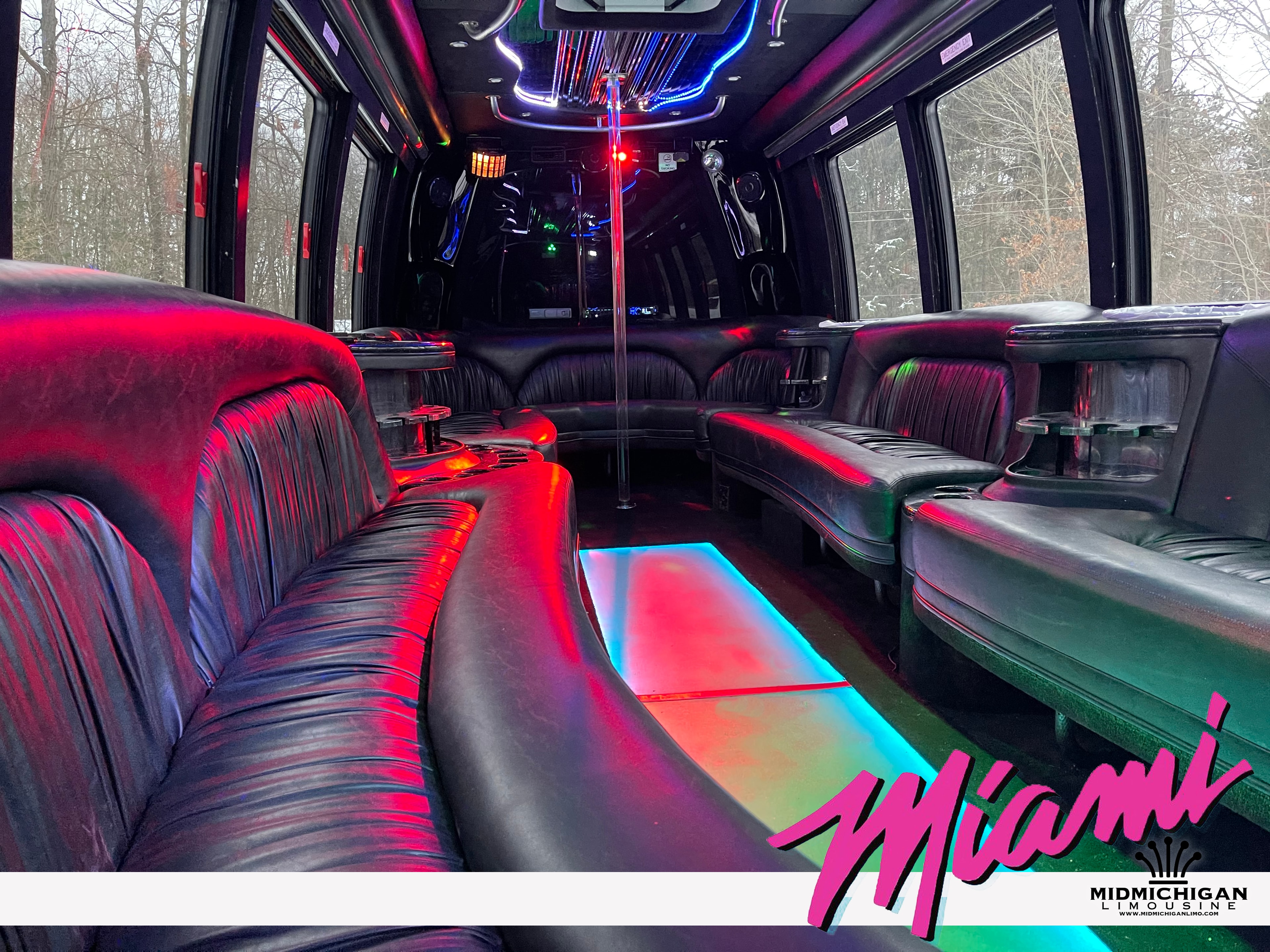 Miami Limo Bus interior — neon pink and cyan lighting