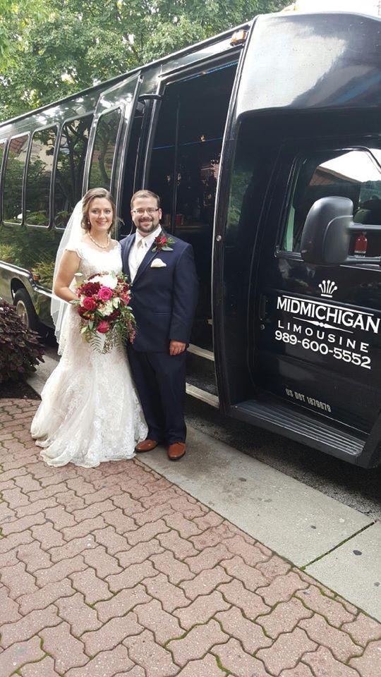 Wedding couple with party bus