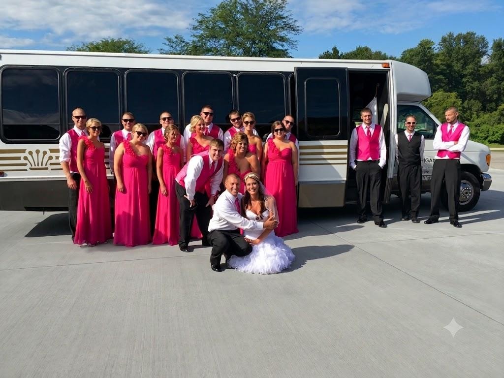 Large wedding party with bridesmaids in pink dresses in front of Mid Michigan Limousine bus